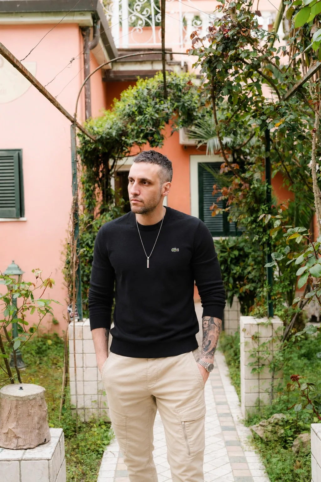 Michael standing in a quiet garden setting